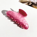 Detail of pink marble textured acrylic claw clip showing high-quality finish and teeth - Marble Rose Red (9cm Square)