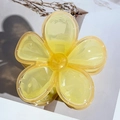 Detailed top view of lemon yellow jelly flower hair claw clip with transparent finish - Yellow Orange Geometric