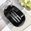 Detail view of the inner comb structure and glossy black finish of this oval hair claw clip - Glossy Black