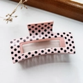 Elegant light pink hair claw clip with black polka dots in a rectangular hollow design - Medium Polka Dot Pink
