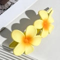 Close-up of yellow frangipani flower hair clip with realistic matte texture detail - Yellow Orange