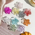Close-up of colorful 2.5cm plumeria hair claws made of high-quality acrylic resin - 2.5cm Frangipani - Transparent Colors (Bagged)