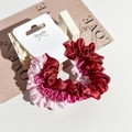 Detail of red and pink satin scrunchies set with glossy texture and paper card packaging - Burgundy/Rose Pink/Light Pink