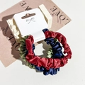 Three-pack of satin silk scrunchies in red, navy blue, and green on a display card - Burgundy/Navy/Fruit Green