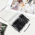 Set of black metal hair clips organized in a transparent storage box for hairstyling - 5.5cm Curved Black Bobby Pin