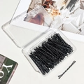 Detail showing wave-shaped black bobby pins set inside a clear portable storage box - 5.5cm Wavy Black Bobby Pin