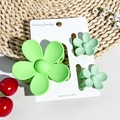 Three-piece set of matte green flower hair claws on a jewelry display card - Matte Fruit Green