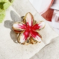 Close-up of golden metal frangipani hair claw with gradient rose red enamel finish - 3cm Off White Rose Red Heart Frangipani Metal Claw
