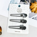Détail de trois barrettes à cheveux en métal argenté brillant sur carton blanc - 6cm Goutte Creuse (Ensemble de 3)