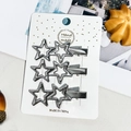 Détail de trois pinces à cheveux en forme d'étoile argentée sur carte cadeau - 5.5cm Double Étoile (Ensemble de 3)