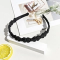 Close-up of matte black wavy headband with bow design and non-slip inner teeth detail - Matte Bowknot Headband - Black