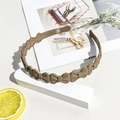 Detail view of khaki wave headband featuring anti-slip teeth and matte bow design - Matte Bowknot Headband - Milk Coffee