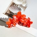 Set of two orange marble plumeria hair claws for elegant summer styling - Orange Red