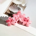 Three pink marble frangipani flower hair claws with elegant textured resin finish - Deep Pink