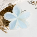 Close-up of blue flower hair claw clip with cream accents on rustic fabric background - Blue with Beige Edge