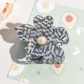 Detail of five-petal flower hair claw clip with grey-blue checkered pattern and pearl - Gray Blue