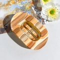 Detail of a large oval matte hair claw clip with earthy tone artistic stripes - 9.5CM / Hand-painted Orange