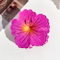 Close-up of a pink Frangipani shark clip featuring textured petals and a yellow core - 7.5cm Hibiscus Claw Clip - Gradient Rose Red