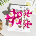 Three-piece rose red plumeria hair clip set with floral prints on a display card - Rose Red Small Flower Style (UV Printed Plumeria 3-Piece Set - ABS - 103-1)