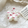 Close-up detail of frangipani hair claw clip with red bow pattern and polished finish - Bow Dot Style (99-3)