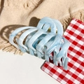 Macro shot of light blue marble acetate claw clip with textured wave pattern - Lake Blue Marble Texture (F-2506)
