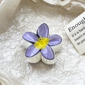 Detailed macro view of purple plumeria flower hair claw clip with yellow center detail - Purple Gradient Floral Style (110-B5)