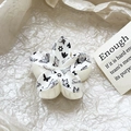 Macro view of white floral hair claw with butterfly print and Sweet text detail - Black Butterfly Floral Style (115-3)