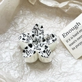 Detailed view of Frangipani claw clip with heart and love print on beige textured paper - Vintage Heart Style (115-4)
