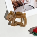Detailed view of brown dog-shaped acetate hair claw clip on a minimalist aesthetic background - Coffee Dog Style