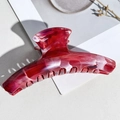 Macro view of the marble patterned red and white hair claw clip with strong metal spring - PS / 11.5cm Straight / Burgundy