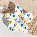 Close-up detail of white frangipani hair claw clip with colorful heart pattern print - White Red Yellow Blue Heart Style / ABS