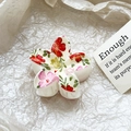 Detailed close-up of a floral print frangipani hair claw clip on beige aesthetic background - Red Pink Pastoral Floral Style (118-4)