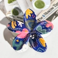 Macro shot of flower claw clip featuring artistic graffiti patterns and resin texture - ABS / Deep Blue Graffiti Floral-ABS Beige 154-6