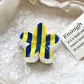 Close-up of blue and yellow striped frangipani hair claw clip on minimalist paper background - Blue Yellow Stripe Style (121-8)