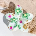 Close-up of plumeria hair claw clip with floral and strawberry UV print on linen - Light Green Strawberry Gold Pattern Style / ABS