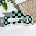 Detailed view of square green checkerboard hair claw clip with white teeth on linen - Black Green Checkerboard Style (151-3)