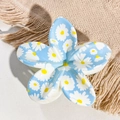 Close-up of blue floral hair claw clip with white daisy print and glossy finish - Sky Blue White Petal Yellow Core Daisy Style / ABS