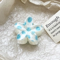 Detailed close-up of a white plumeria hair claw clip with blue daisy floral prints - Blue Daisy Style (126-6)