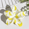 Detail of flower hair claw clip with yellow banana print and small colorful dots - Banana Print (146-6)