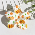 Macro shot of egg-flower hair claw clip featuring fresh peach pattern prints - Peach Print (147-5)