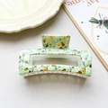 Detail view of a mint green rectangular hair claw clip with delicate yellow floral patterns - Light Green Floral Square Style (001-6)