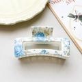 Detail of 8.5cm square hair claw with blue floral print and glossy finish texture - Ivory Blue Floral Square Style (001-9)