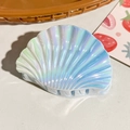 Macro detail of the seashell hair claw clip with aurora pearl finish and sturdy teeth - Cyan Blue