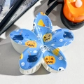 Close-up of blue flower hair claw clip with Halloween pumpkin and skull UV printing - 8cm Uv Printed Frangipani Flower - Abs Beige 01-7 / ABS