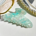 Detail view of large marble mint green hair claw clip with iridescent pearlescent finish - 9cm Square Head Style / Iridescent Cyan
