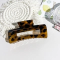 Close-up of leopard print rectangular hair claw clip with cutout geometric design - 10.5cm Square-Glossy Coffee Leopard