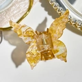 Detailed butterfly hair claw clip with amber marble texture and subtle purple shimmer - 7cm Butterfly Style / Rainbow Gold