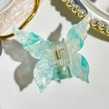 Detailed top view of butterfly hair claw clip with blue marble pearlescent finish - 7cm Butterfly Style / Iridescent Cyan