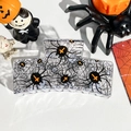 Detail of square Halloween hair claw with spider web and orange cross patterns - Solid Square - Spider Spinning