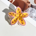 Macro view of a cute yellow and pink floral hair claw clip on a stylish table background - Plumeria Floral Style (162-1) / 8cm Single Piece